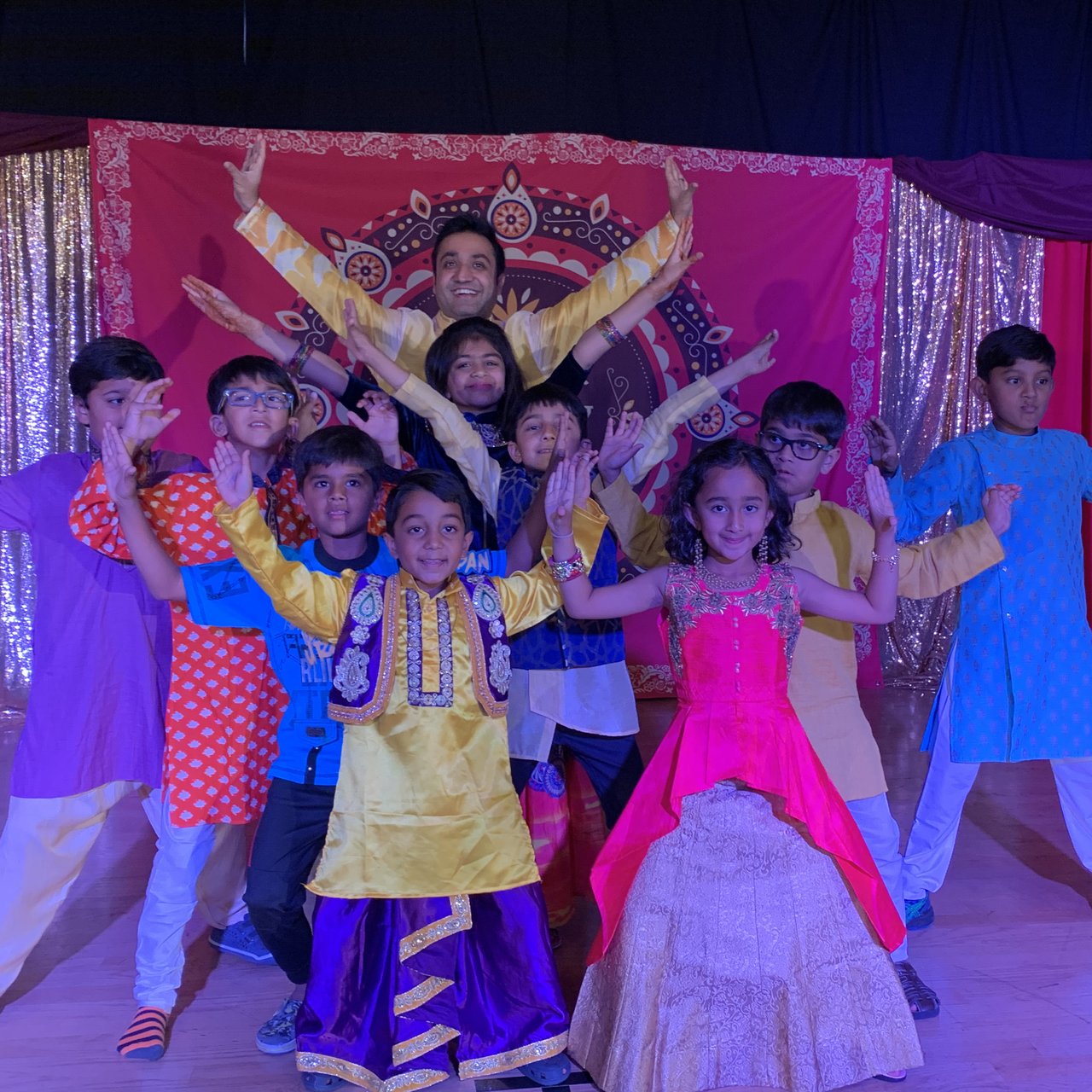 FuzeBnB kids in costume on stage